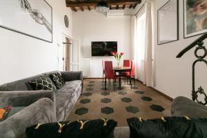 a living room with a couch and a table at Rooftop Campo dei Fiori in Rome
