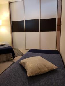 Posteľ alebo postele v izbe v ubytovaní BUTOROWY RESIDENCE Apartament "GÓRSKA ORCHIDEA"