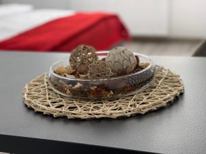 a small bowl of cactuses on a table at Maple Lodge in Braşov