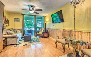 a living room with a couch and a table at GARDEN VIEW STUDIO - KONA ISLANDER INN CONDOS condo in Kailua-Kona