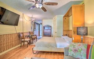 a bedroom with a bed and a couch and a tv at GARDEN VIEW STUDIO - KONA ISLANDER INN CONDOS condo in Kailua-Kona +19 photos