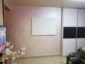 Televízia a/alebo spoločenská miestnosť v ubytovaní BUTOROWY RESIDENCE Apartament "GÓRSKA ORCHIDEA"