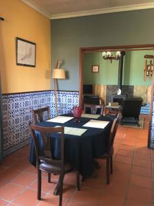 a dining room with a table and chairs at Vagos Art.Lab in Vagos