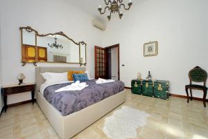 Luxury Domus AmaDora tesisinde bir odada yatak veya yataklar