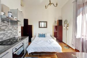 מיטה או מיטות בחדר ב-Luxury Domus AmaDora