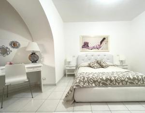 A bed or beds in a room at Bella Matera
