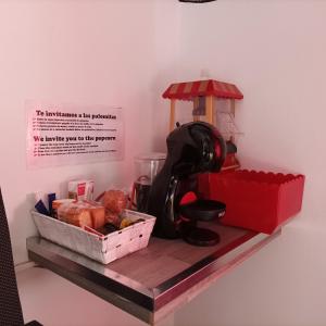 a shelf with a toy race car and a basket of food at La Casona de Betanzos in Betanzos