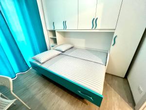Postel nebo postele na pokoji v ubytování APPARTMENTO per 6 persone A MARINA CENTRO