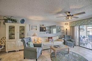 a living room with a couch and two chairs at Pool and Canal Access Central Cape Coral Condo! in Cape Coral