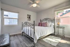a bedroom with a bed and a ceiling fan at Charming San Diego Apartment - Walk to Bay! in San Diego