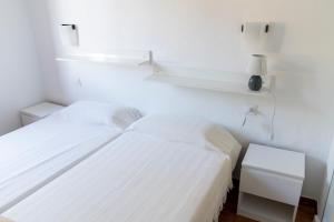 Postel nebo postele na pokoji v ubytování Apartamento Menorca Arenal d'en Castell