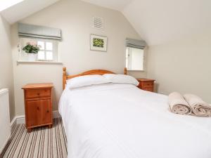 Postel nebo postele na pokoji v ubytování Spring Hill Cottage