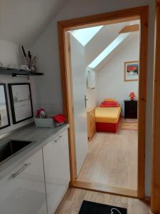 Katil atau katil-katil dalam bilik di Dvoupokojový apartmán s kuchyňským koutem