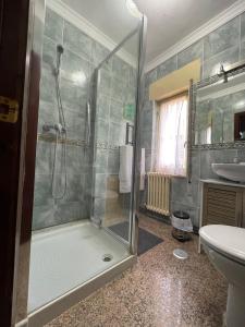 a bathroom with a shower and a sink at Villa en la Reserva de la Biosfera de Gordón in Huergas y El Millar +39 photos