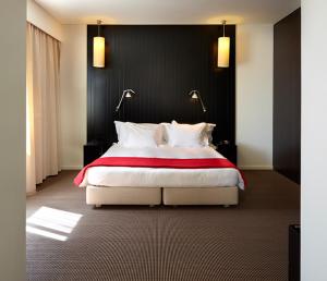 Hotel Flor De Sal tesisinde bir odada yatak veya yataklar