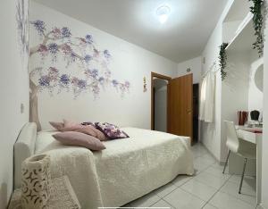 A bed or beds in a room at Bella Matera