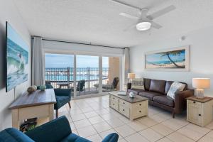 a living room with a couch and a table at Paradise Beach Club - Ground Floor & Townhouses in Satellite Beach