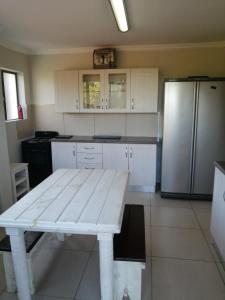 Η κουζίνα ή μικρή κουζίνα στο Sola Fide Self Catering Apartment