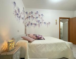 A bed or beds in a room at Bella Matera