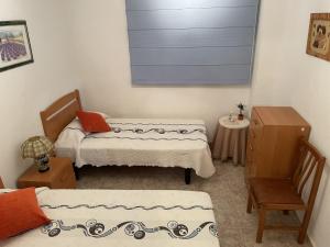 Postel nebo postele na pokoji v ubytování Apartamento el Maset + 15 fotografií