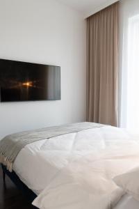 Posteľ alebo postele v izbe v ubytovaní Apartamenty DES-Zator