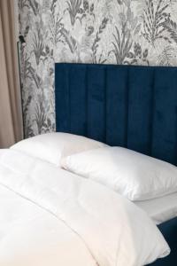 Posteľ alebo postele v izbe v ubytovaní Apartamenty DES-Zator