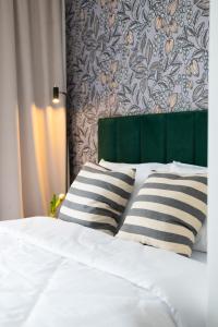 Posteľ alebo postele v izbe v ubytovaní Apartamenty DES-Zator