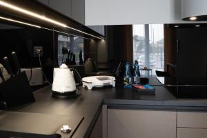 Kuchyňa alebo kuchynka v ubytovaní Apartamenty DES-Zator