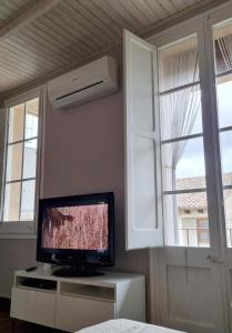 A television and/or entertainment centre at Apartment Sant Francesc