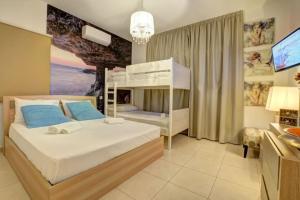 a bedroom with a bunk bed and a television at SunnyVillas: 4BR Villa☆Private Pool + Jacuzzi - Villa Amelie in Protaras +78 photos