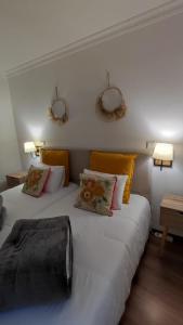 Uma cama ou camas num quarto em Meimoa Guesthouse