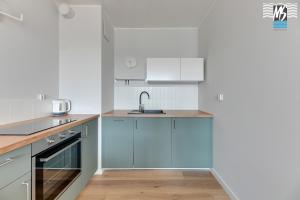 Kuchyňa alebo kuchynka v ubytovaní Ms Apartments Top Center VIII