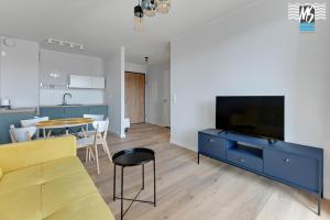 Televízia a/alebo spoločenská miestnosť v ubytovaní Ms Apartments Top Center VIII