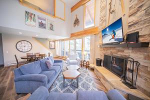 a living room with a couch and a fireplace at Pines 2045 in Keystone