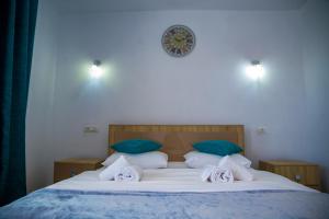 Postel nebo postele na pokoji v ubytování Casa ERICKA