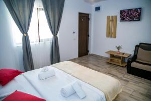 Postel nebo postele na pokoji v ubytování Casa ERICKA