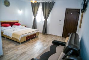 Postel nebo postele na pokoji v ubytování Casa ERICKA