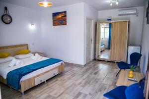 Postel nebo postele na pokoji v ubytování Casa ERICKA
