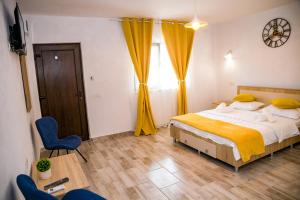 Postel nebo postele na pokoji v ubytování Casa ERICKA