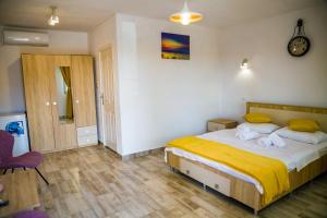 Postel nebo postele na pokoji v ubytování Casa ERICKA