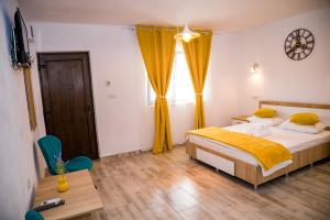 Postel nebo postele na pokoji v ubytování Casa ERICKA