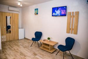 TV a/nebo společenská místnost v ubytování Casa ERICKA