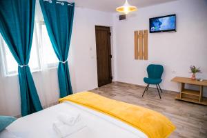 Postel nebo postele na pokoji v ubytování Casa ERICKA