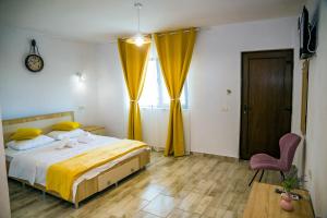Postel nebo postele na pokoji v ubytování Casa ERICKA
