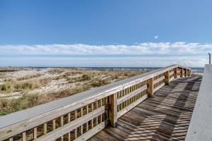 a wooden boardwalk leading to the beach at Island Shores Condos in Gulf Shores