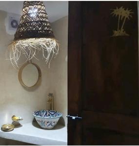 a room with a door and a bowl on a shelf at RIAD - Jnan Bnati - Pool in Marrakesh