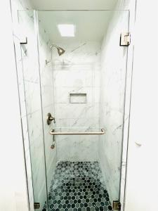a bathroom with a shower with a glass door at Little Tokyo Hotel in Los Angeles +16 photos