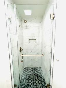 
a bathroom with a shower stall and a toilet at Little Tokyo Hotel in Los Angeles
