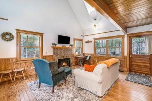 a living room with a couch and a fireplace at Cedar Nook in Arcadia