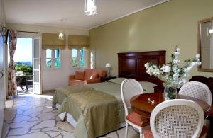 A bed or beds in a room at Dafnoudi Hotel Apartments